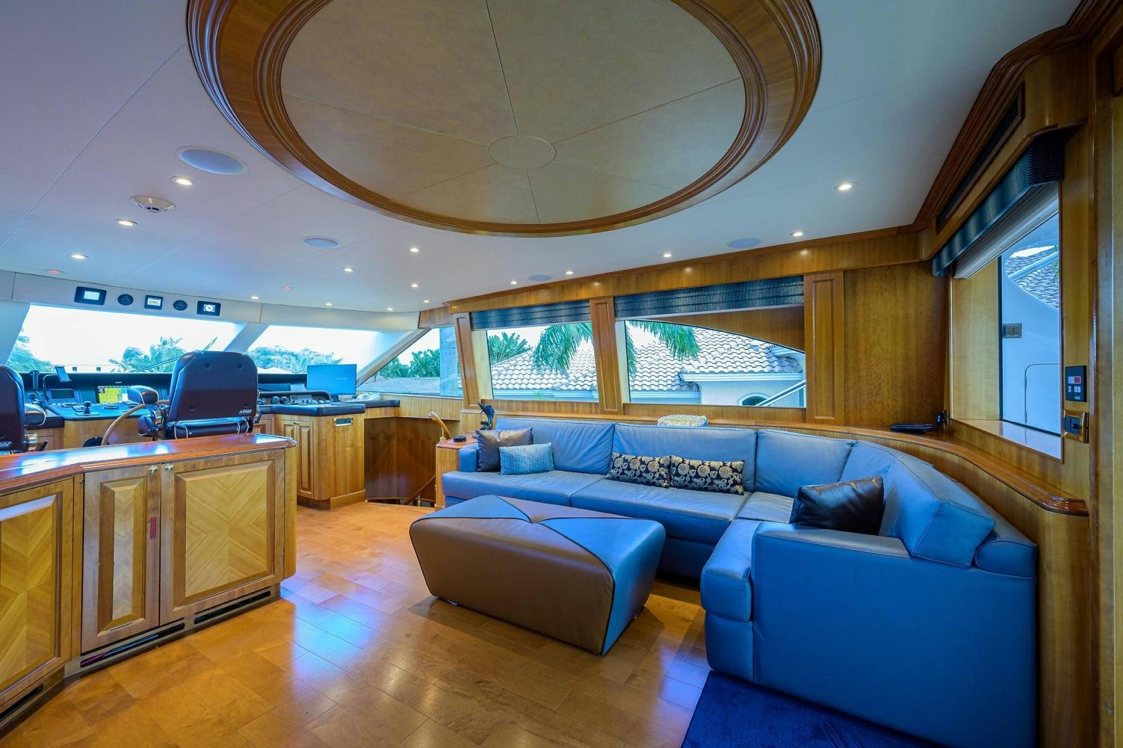 a large living room with a large open window aboard THE CROWN ROYAL Yacht for Sale