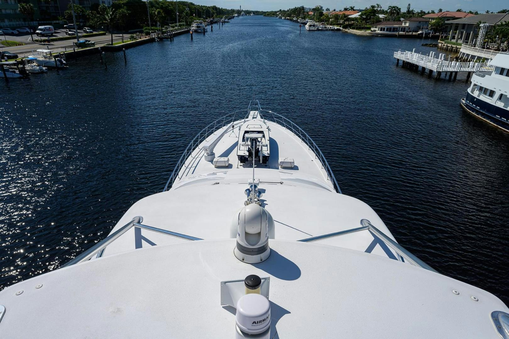 a white boat on a body of water aboard THE CROWN ROYAL Yacht for Sale