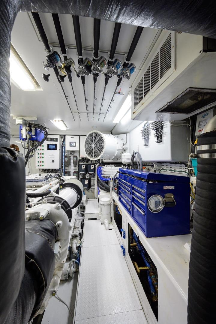 inside of a room with chairs and a fan aboard THE CROWN ROYAL Yacht for Sale