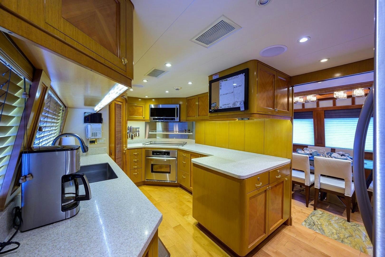 a kitchen with a microwave oven and a microwave aboard THE CROWN ROYAL Yacht for Sale