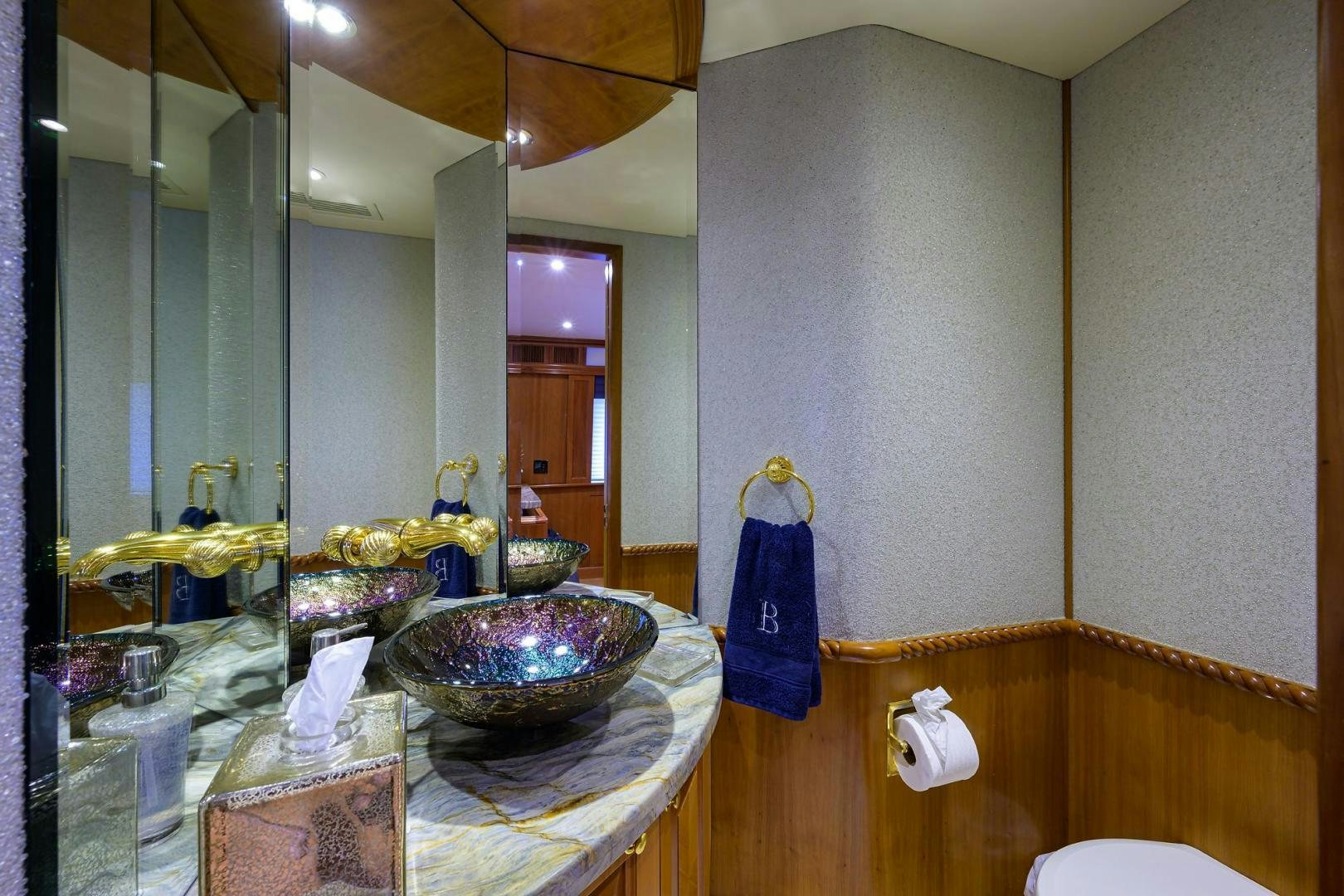 a bathroom with a large mirror aboard THE CROWN ROYAL Yacht for Sale