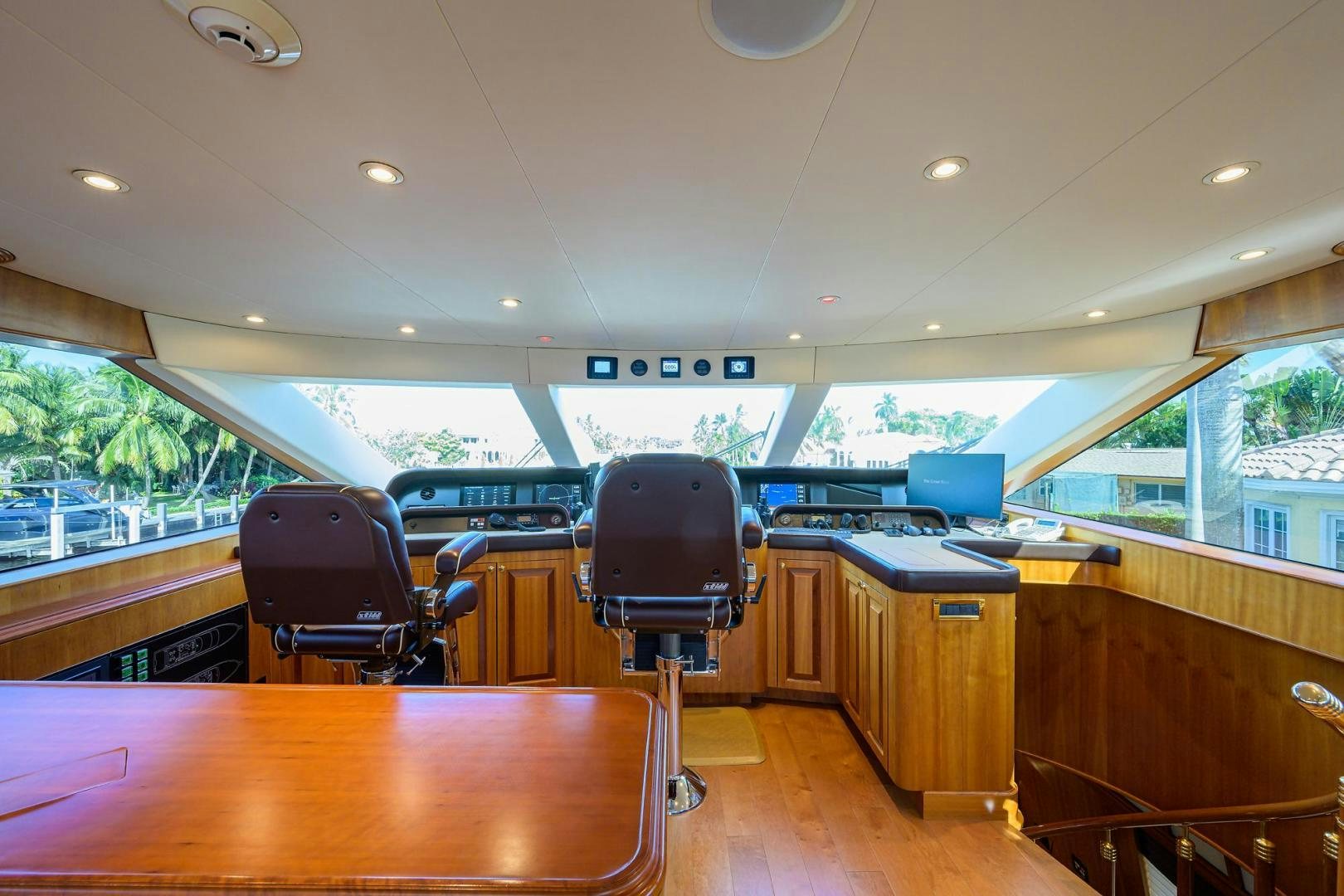 a room with a desk and chairs aboard THE CROWN ROYAL Yacht for Sale