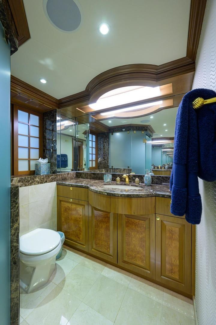 a bathroom with a large mirror aboard THE CROWN ROYAL Yacht for Sale