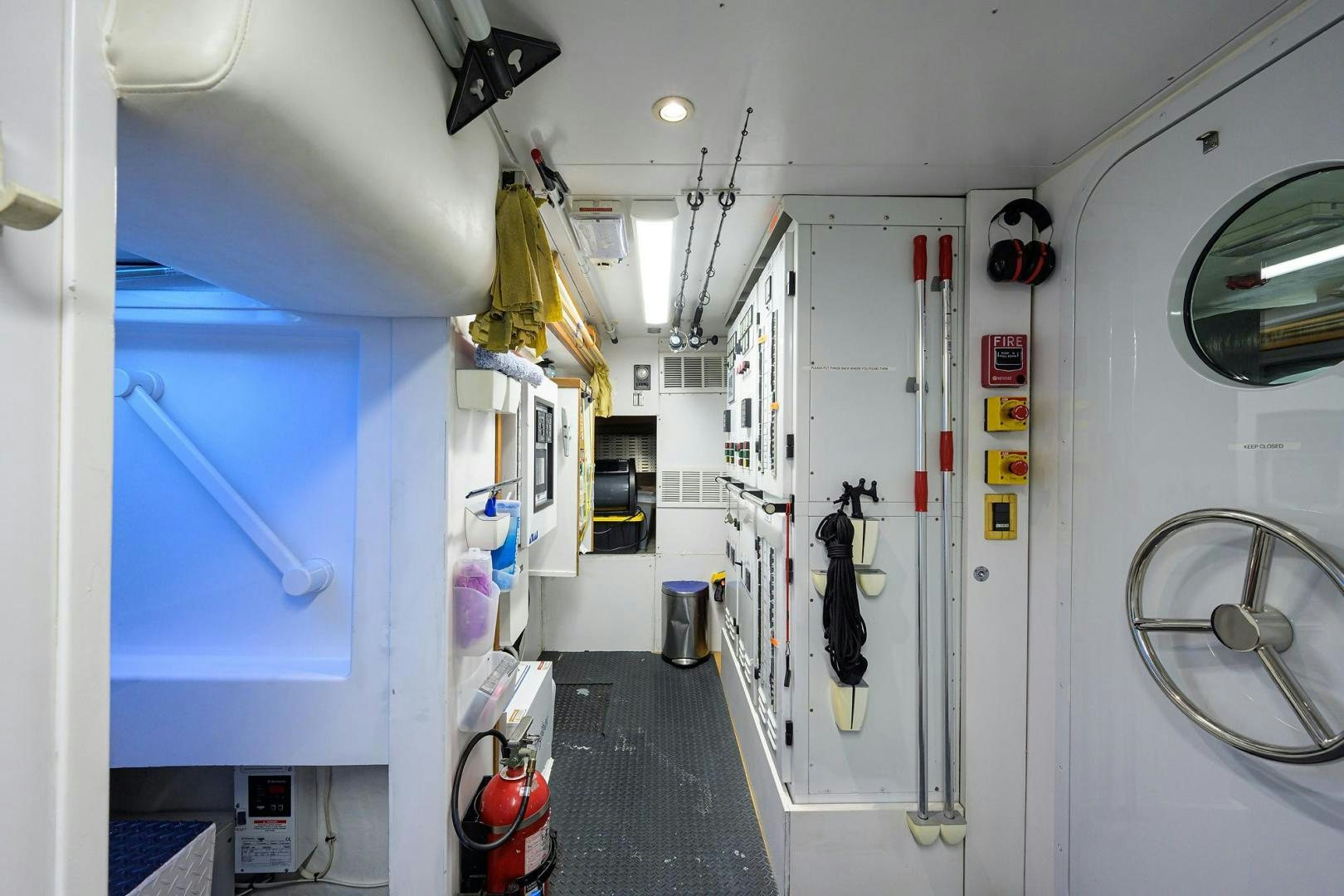 a room with a door and a machine in it aboard THE CROWN ROYAL Yacht for Sale