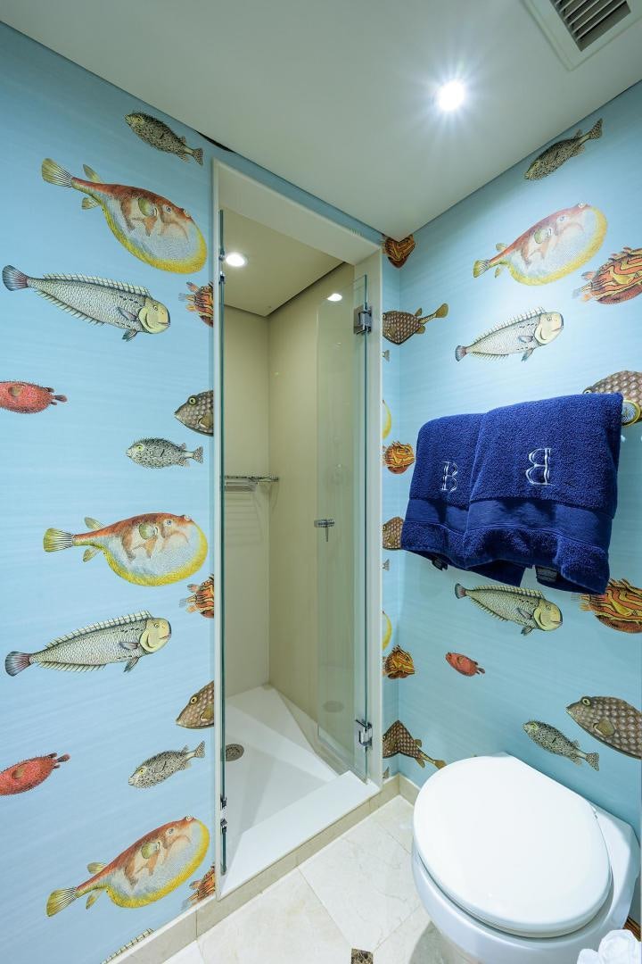 a bathroom with fish and fish swimming in it aboard THE CROWN ROYAL Yacht for Sale