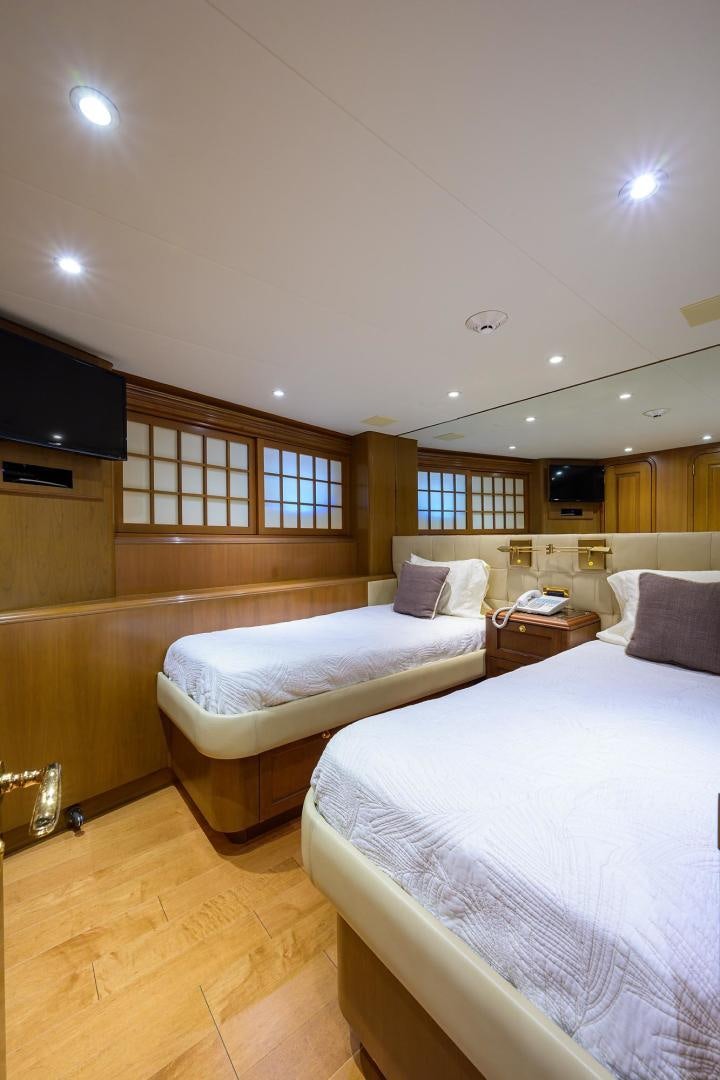 a room with two beds aboard THE CROWN ROYAL Yacht for Sale