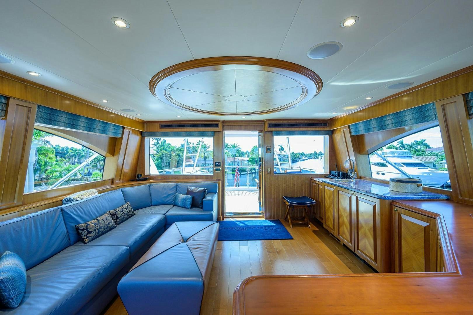 a living room with a large open window aboard THE CROWN ROYAL Yacht for Sale