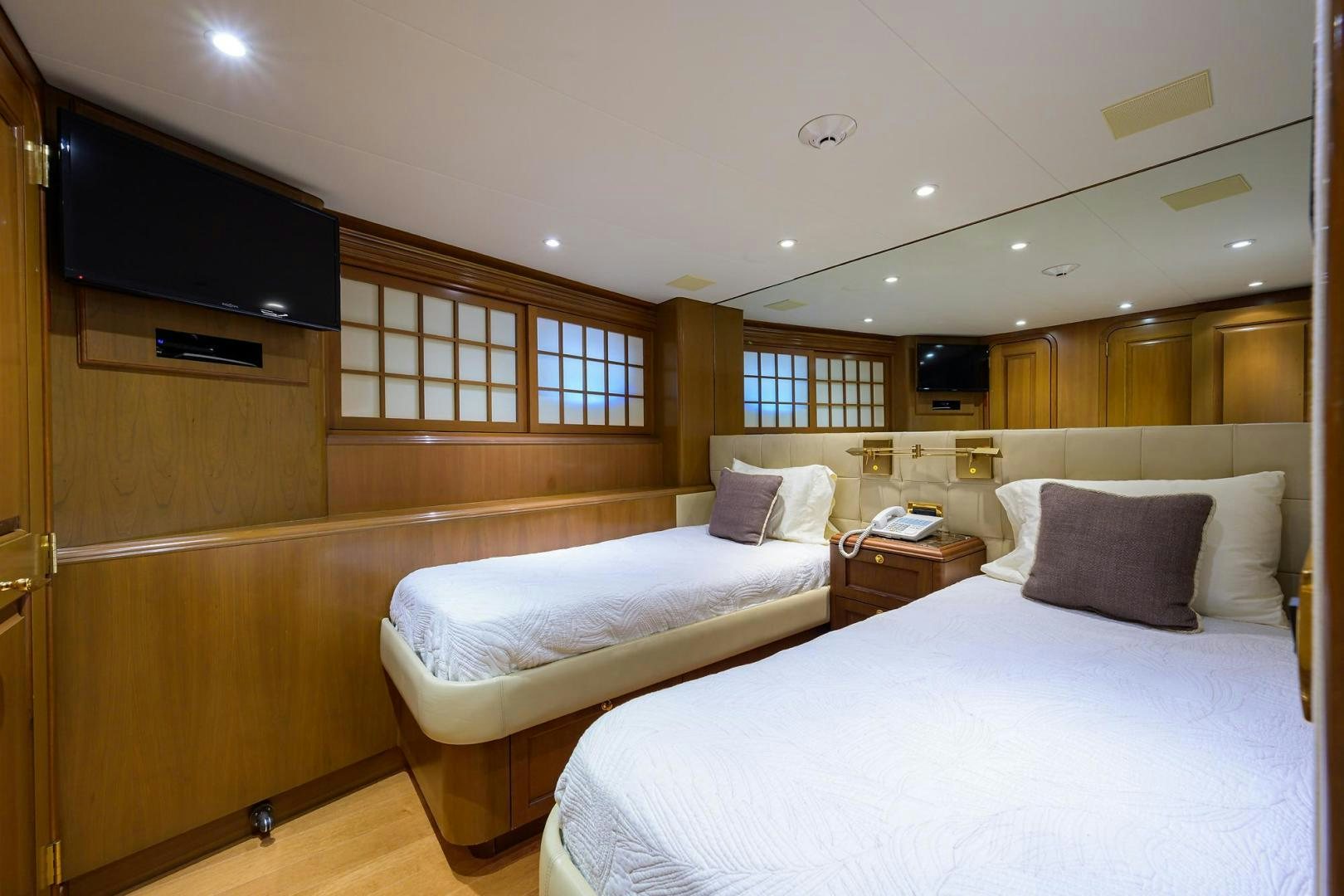a room with a couple of beds aboard THE CROWN ROYAL Yacht for Sale