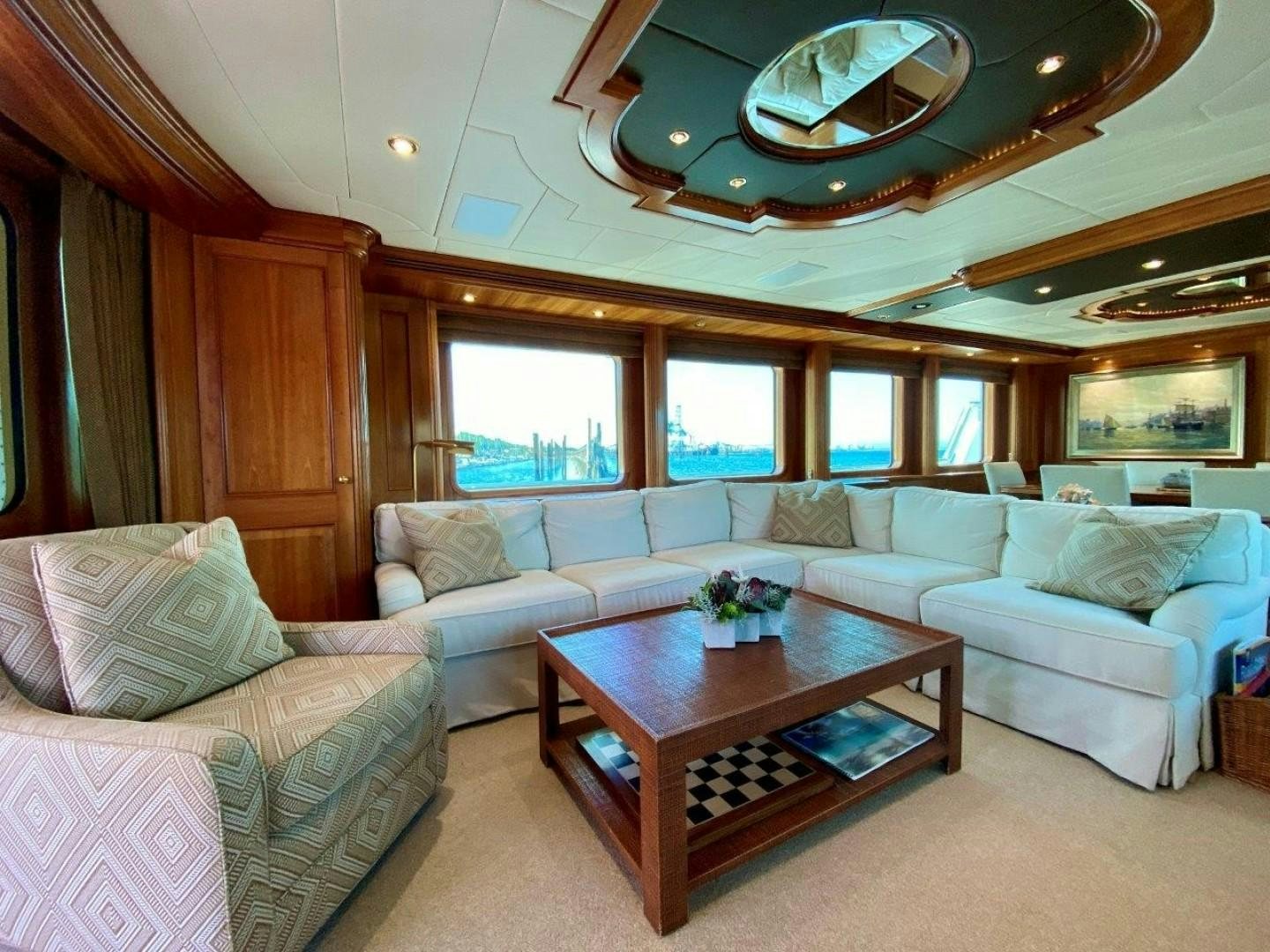 a living room with a couch and a table aboard COASTAL DRIFTER Yacht for Sale