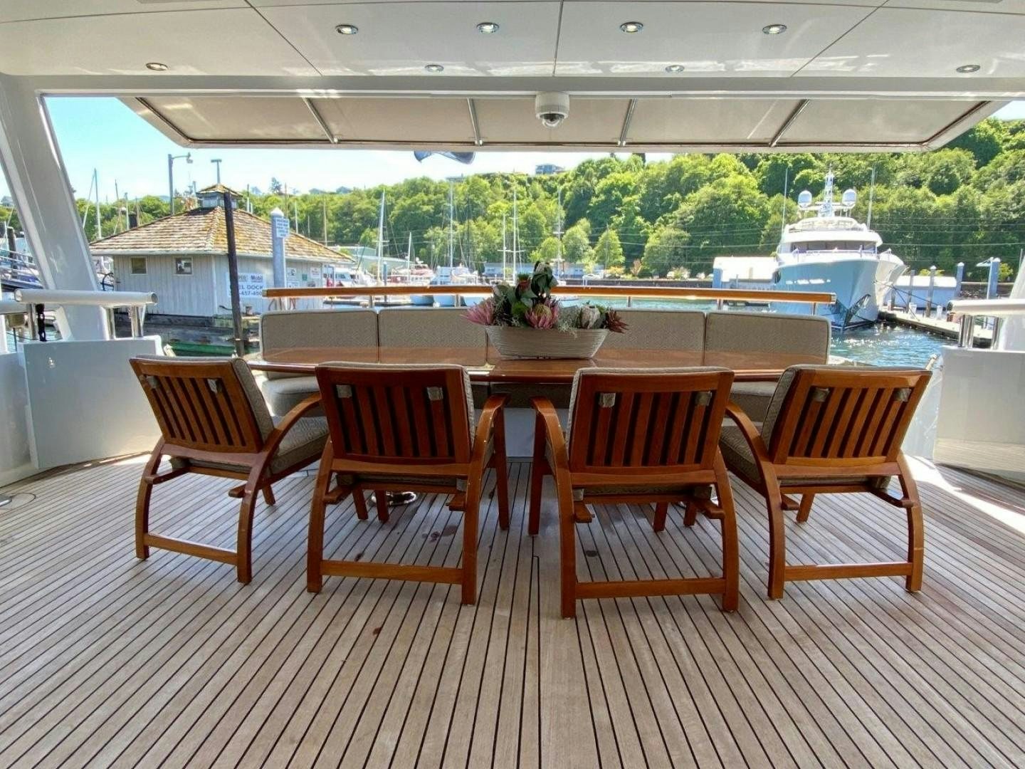 a group of chairs sit on a deck overlooking a body of water aboard COASTAL DRIFTER Yacht for Sale