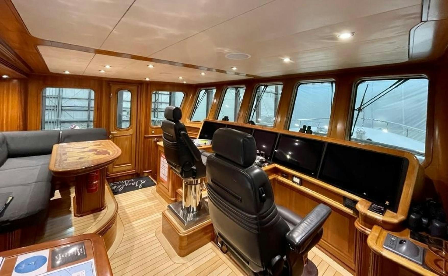 a room with a couch and a television aboard COASTAL DRIFTER Yacht for Sale