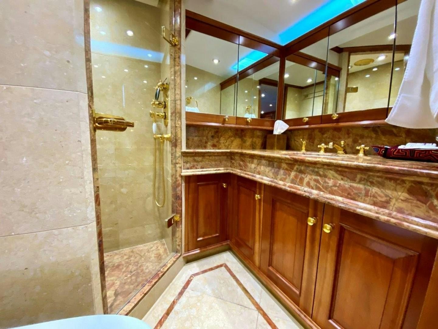 a bathroom with a large mirror aboard COASTAL DRIFTER Yacht for Sale