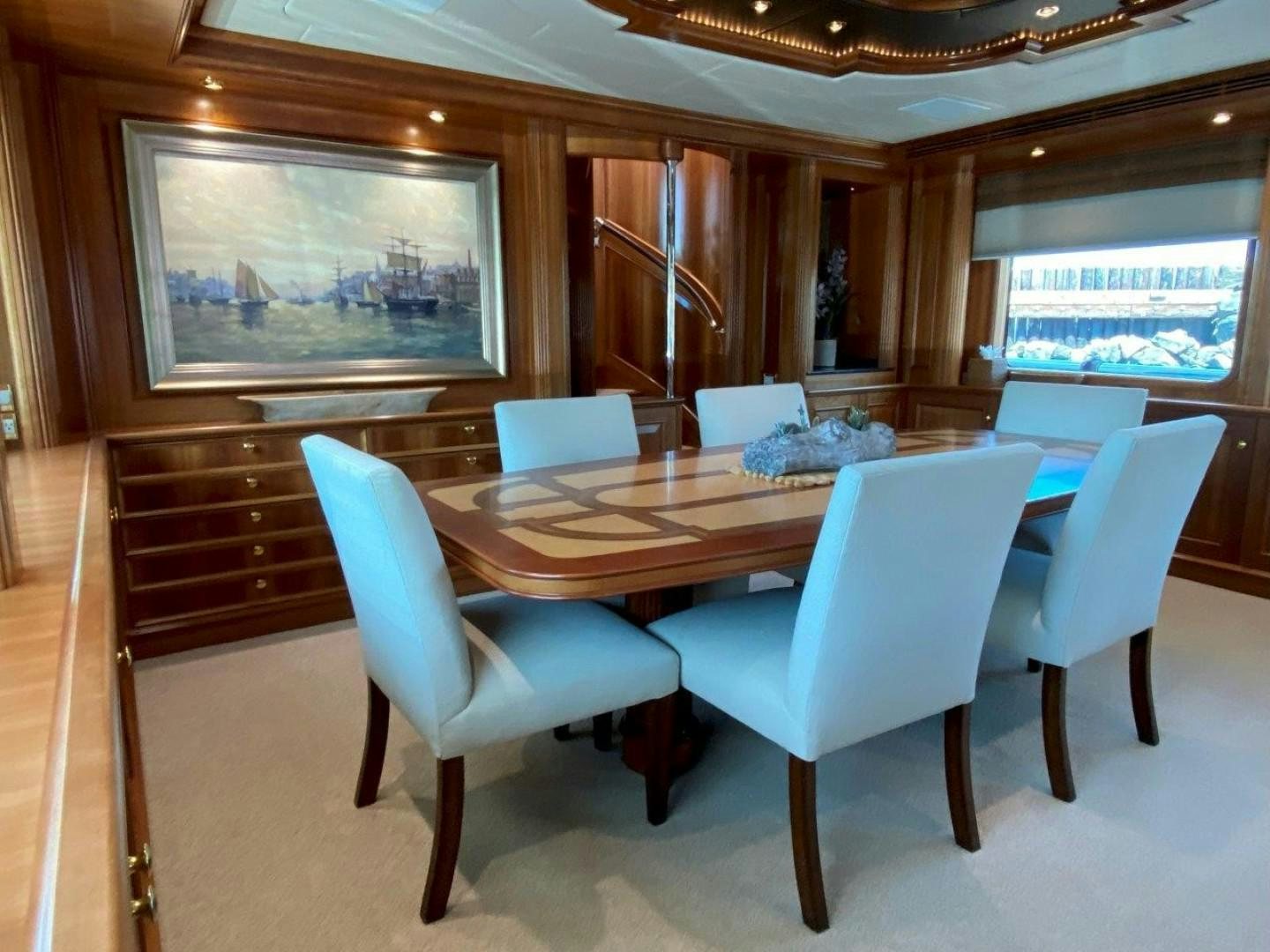 a conference room with a table and chairs aboard COASTAL DRIFTER Yacht for Sale