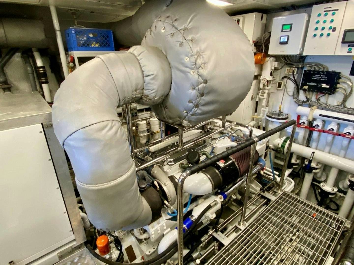 a person in a white suit working on a machine aboard COASTAL DRIFTER Yacht for Sale