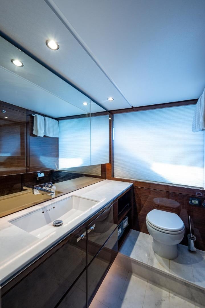 a bathroom with a large mirror aboard I Love It Yacht for Sale