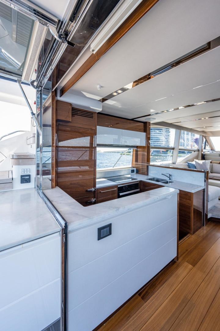 a large kitchen with a large window aboard I Love It Yacht for Sale