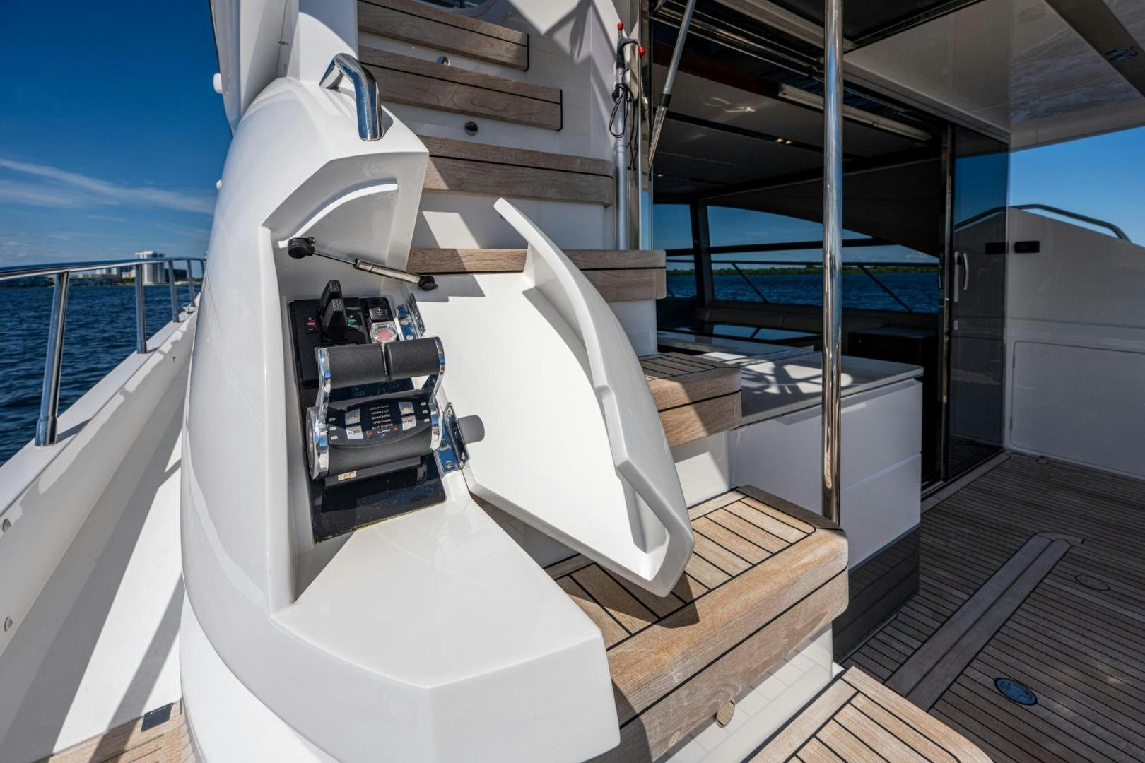 a large white machine on a wooden deck aboard I Love It Yacht for Sale