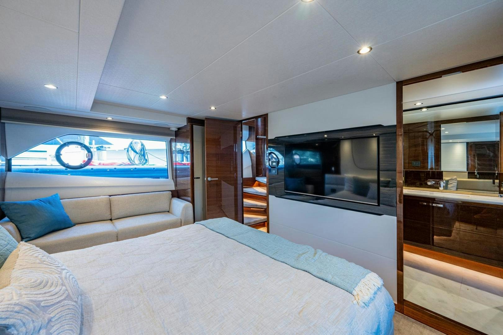 a bedroom with a bed and a tv aboard I Love It Yacht for Sale