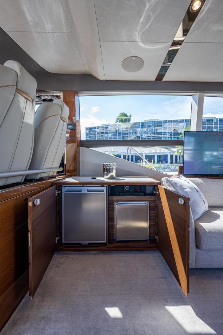 a room with a large window and a view of a city aboard I Love It Yacht for Sale