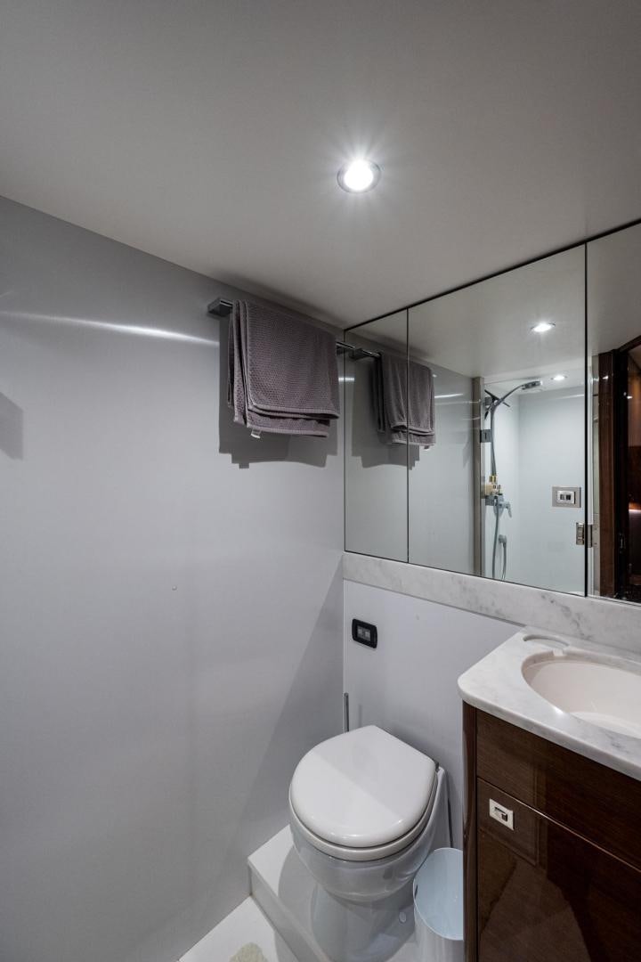 a bathroom with a toilet and a sink aboard I Love It Yacht for Sale