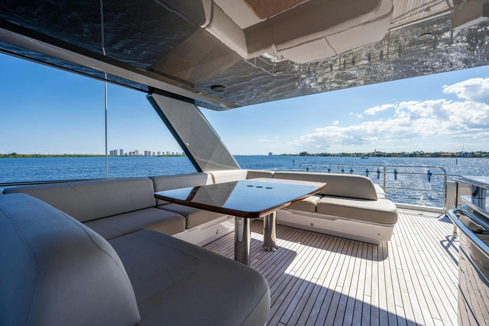 a table and chairs on a deck aboard I Love It Yacht for Sale