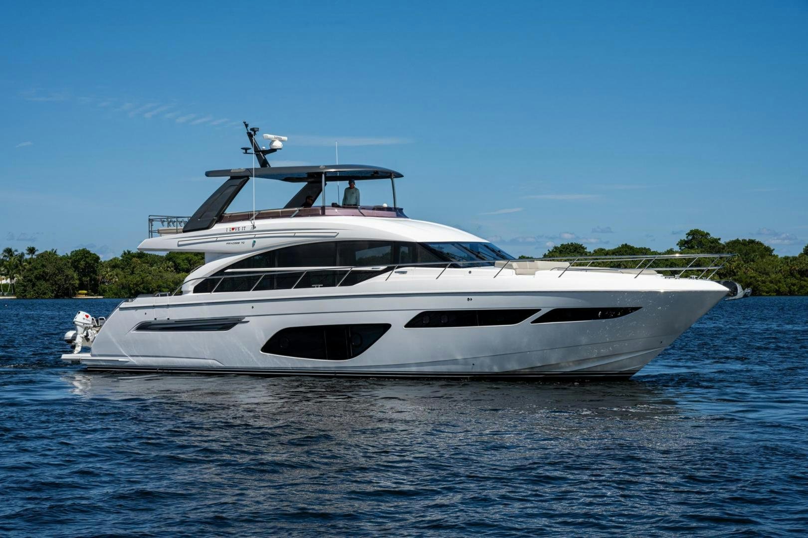 a white yacht on the water aboard I Love It Yacht for Sale