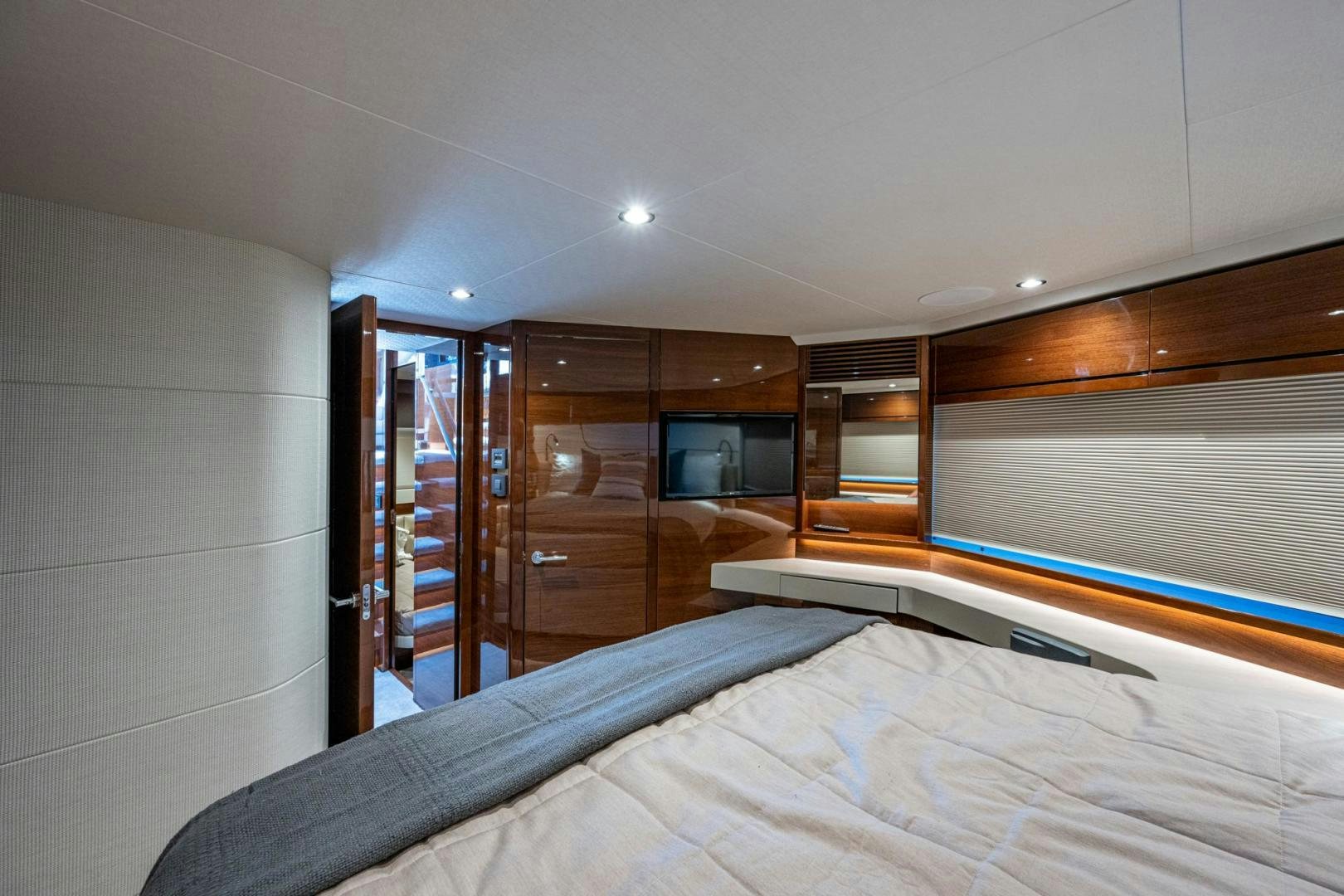 a bedroom with a bed and a closet aboard I Love It Yacht for Sale