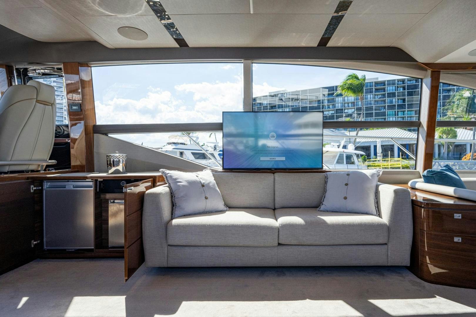 a living room with a large window aboard I Love It Yacht for Sale