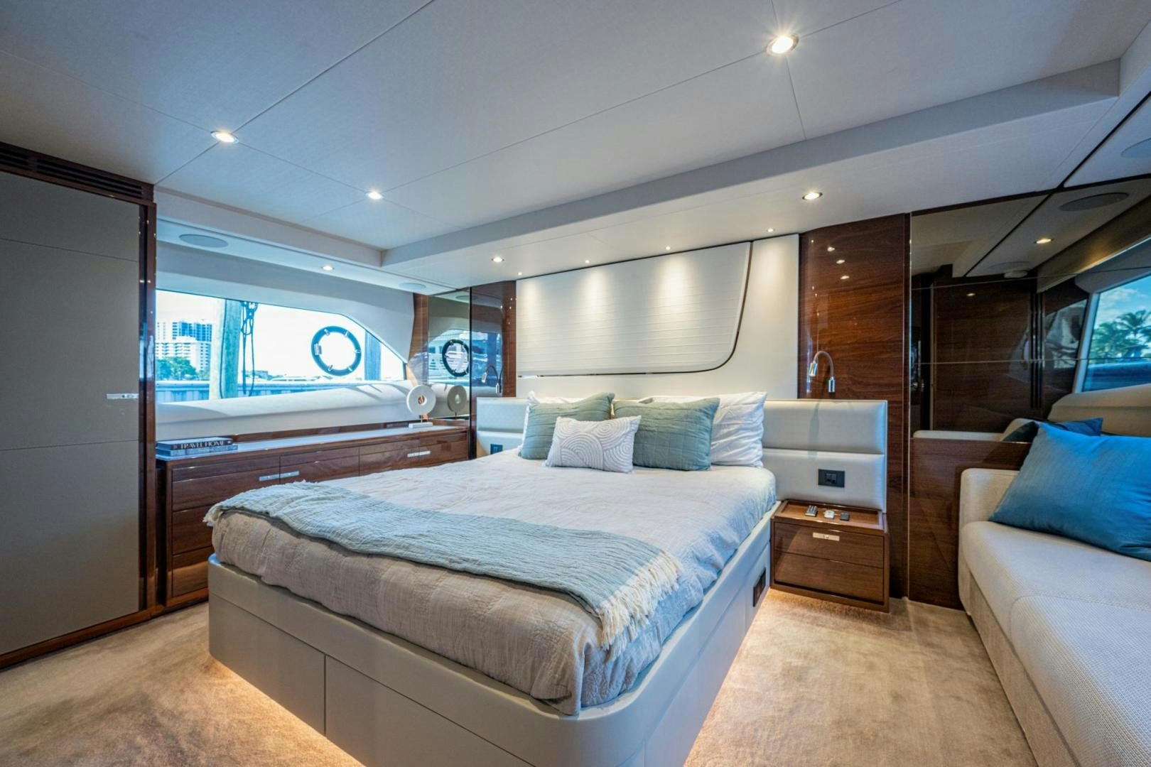 a bedroom with a bed and a desk aboard I Love It Yacht for Sale