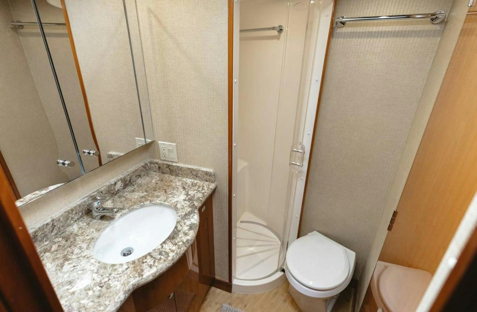a bathroom with a sink toilet and shower aboard LYON FISH Yacht for Sale