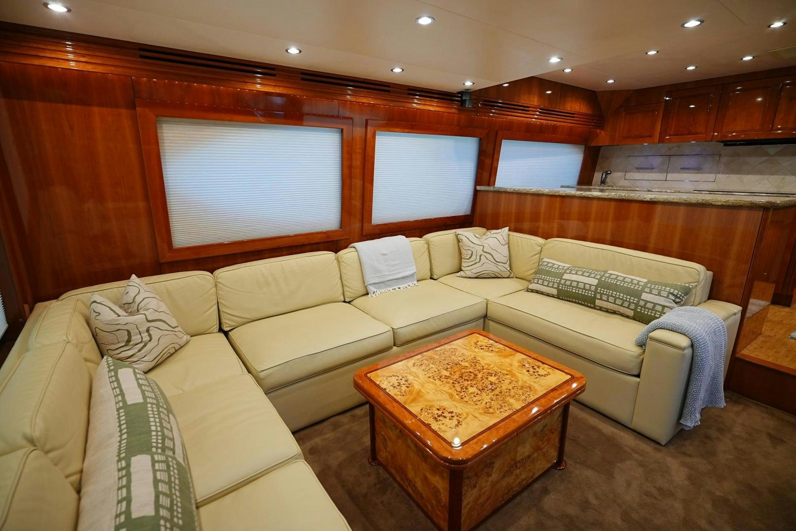 a living room with a couch and a coffee table aboard LYON FISH Yacht for Sale