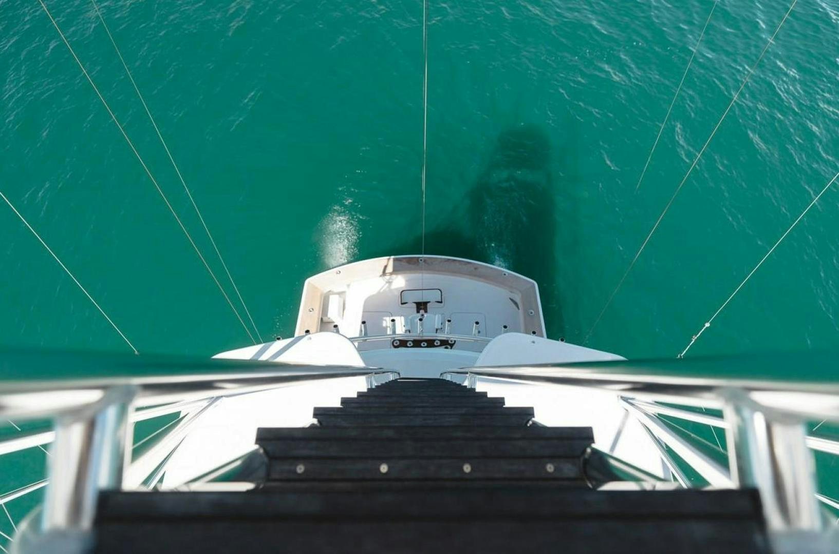 a white building with a green background aboard LYON FISH Yacht for Sale