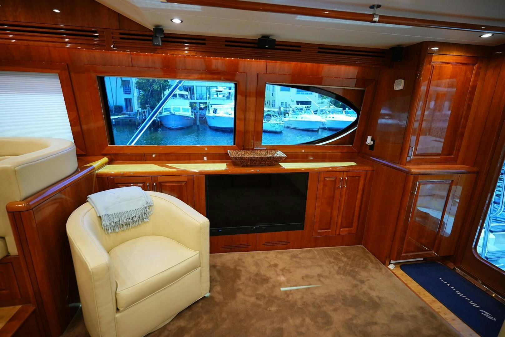 a room with a couch and a television aboard LYON FISH Yacht for Sale