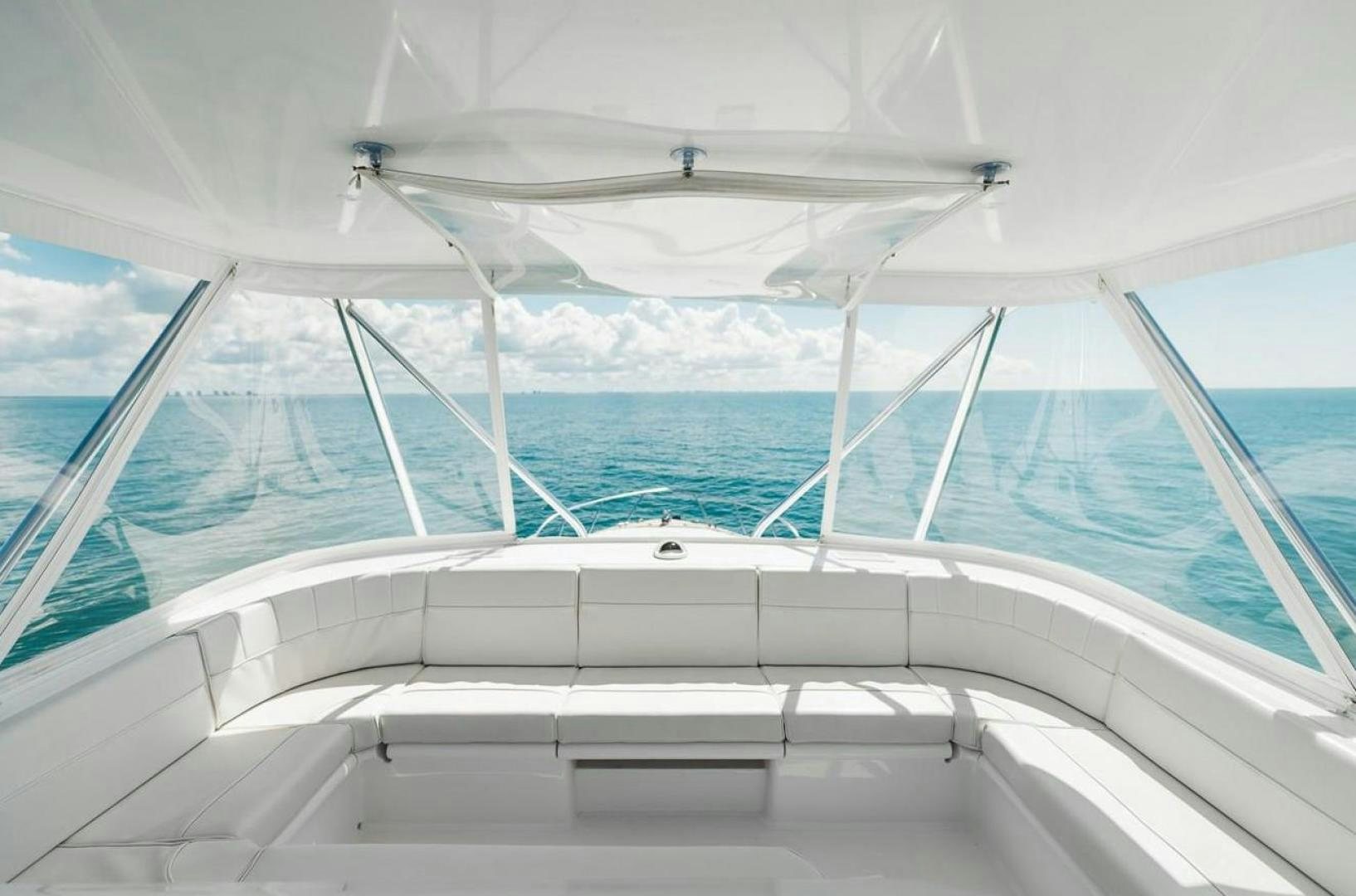 a white boat with a white canopy aboard LYON FISH Yacht for Sale