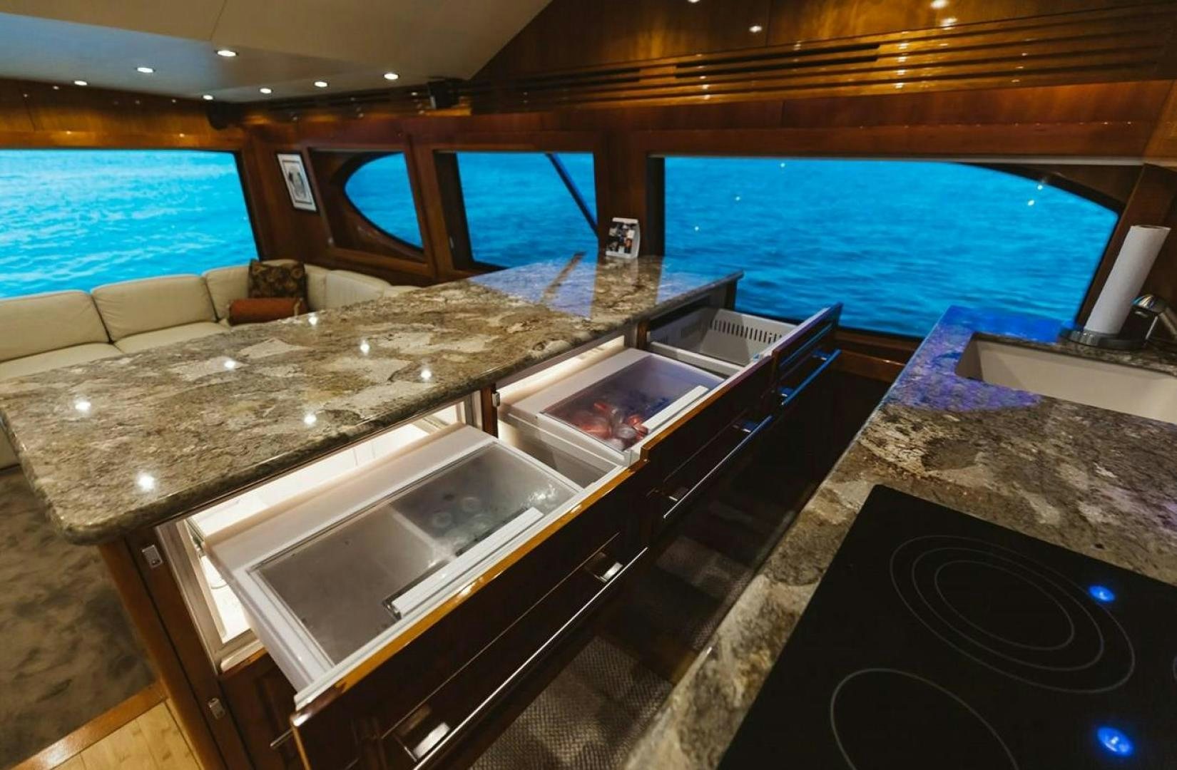 a kitchen with a large island aboard LYON FISH Yacht for Sale