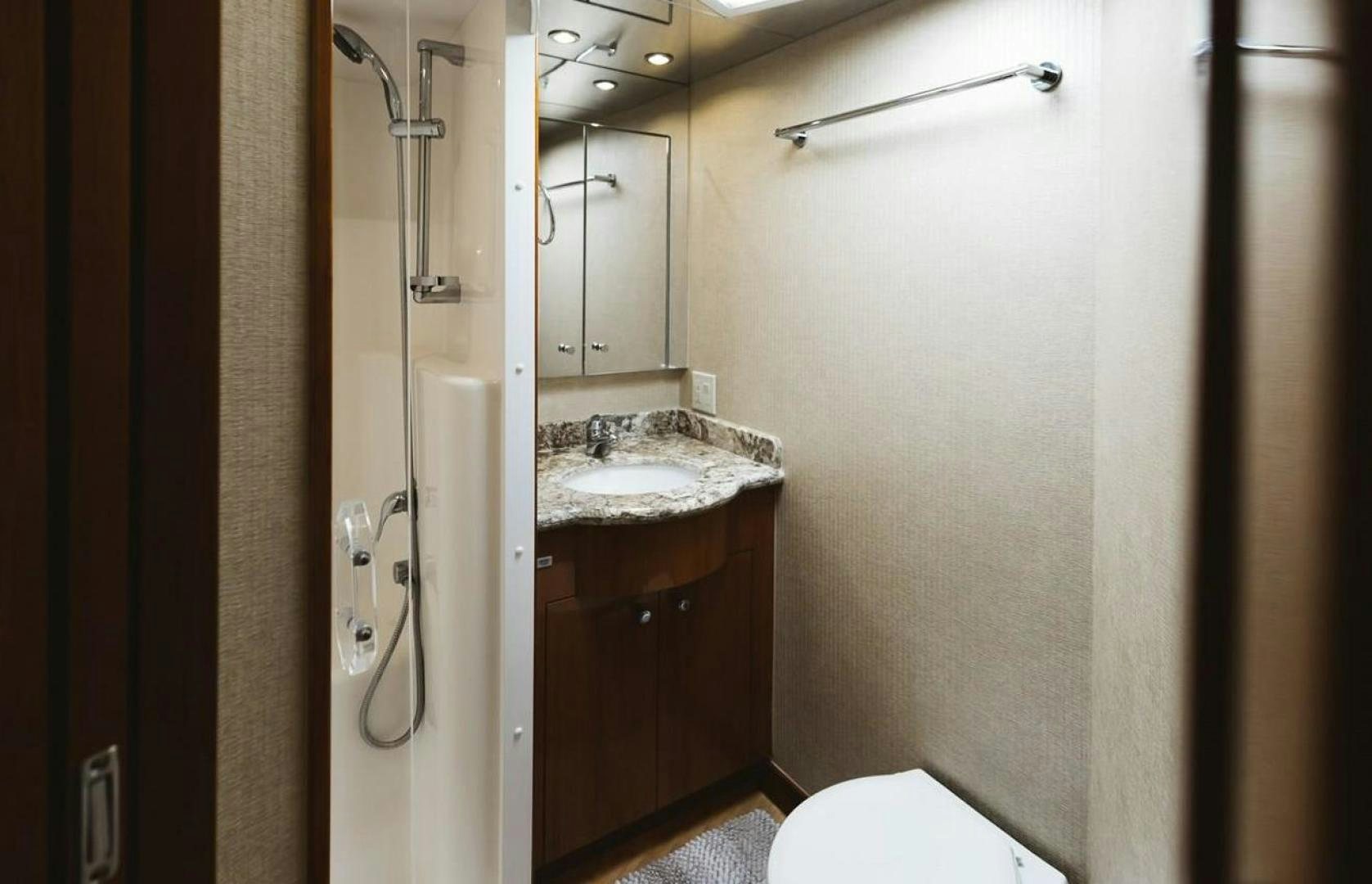 a bathroom with a sink and a shower aboard LYON FISH Yacht for Sale