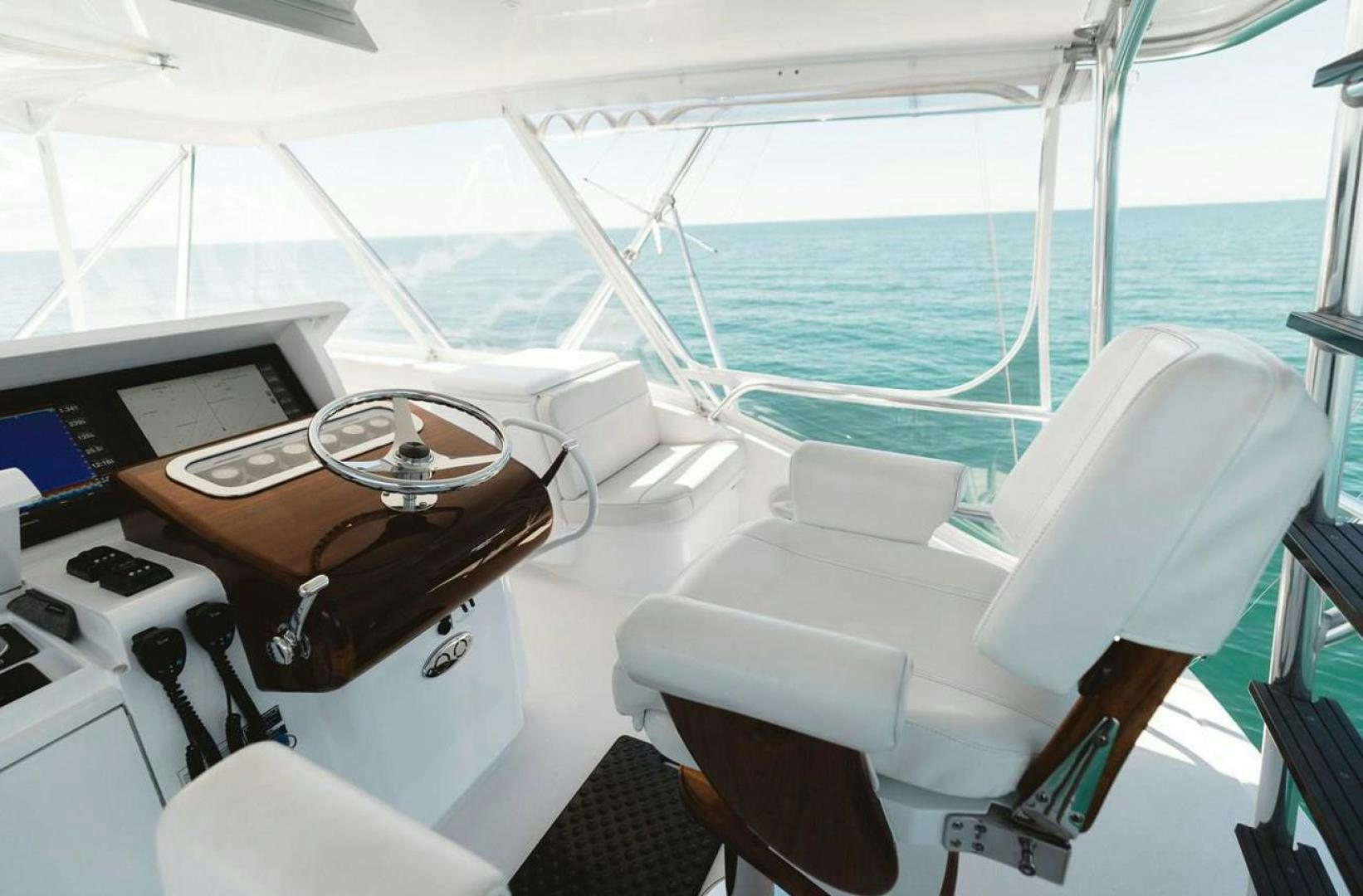 a boat with a table and chairs aboard LYON FISH Yacht for Sale