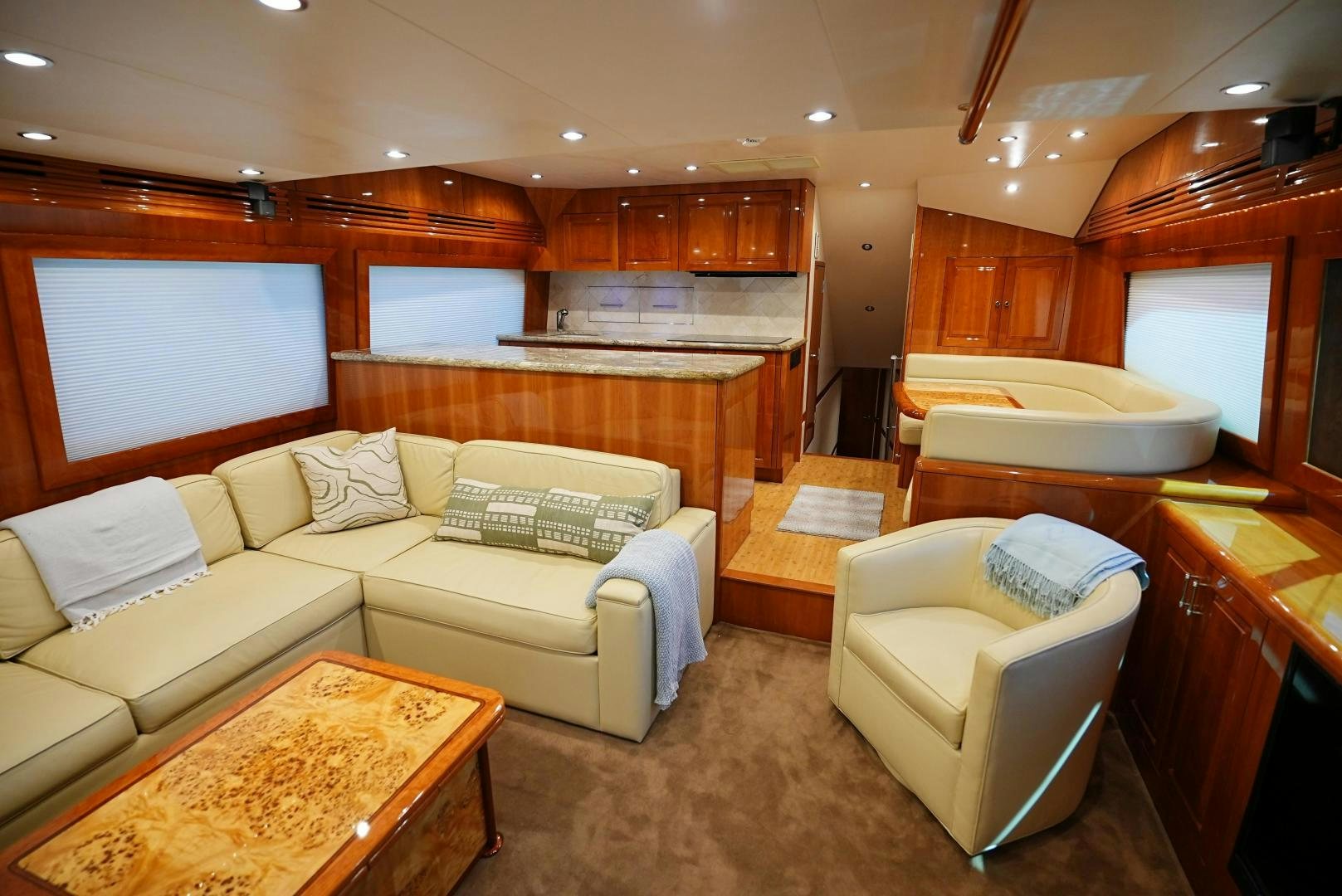a living room with a couch and a table aboard LYON FISH Yacht for Sale