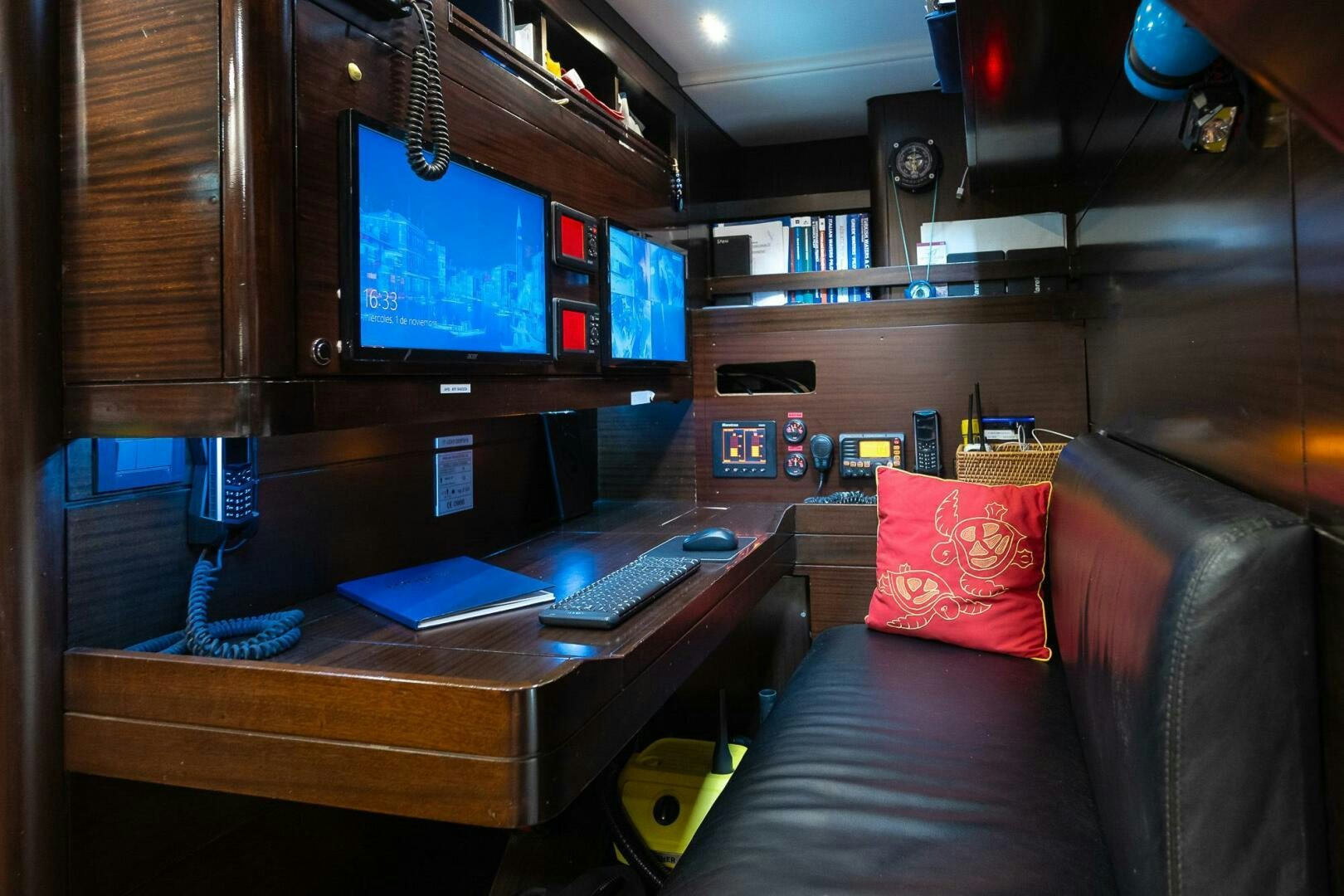 a room with a tv and a couch aboard KAHUNA Yacht for Sale