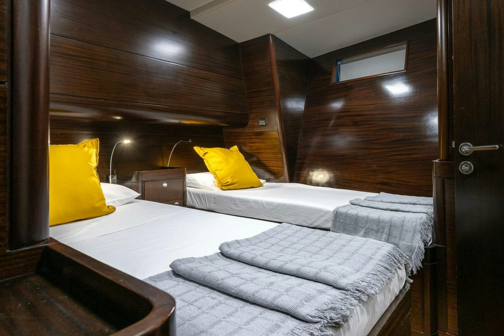 a room with two beds aboard KAHUNA Yacht for Sale