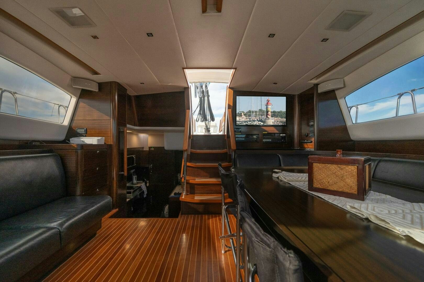 a living room with a couch and a tv aboard KAHUNA Yacht for Sale