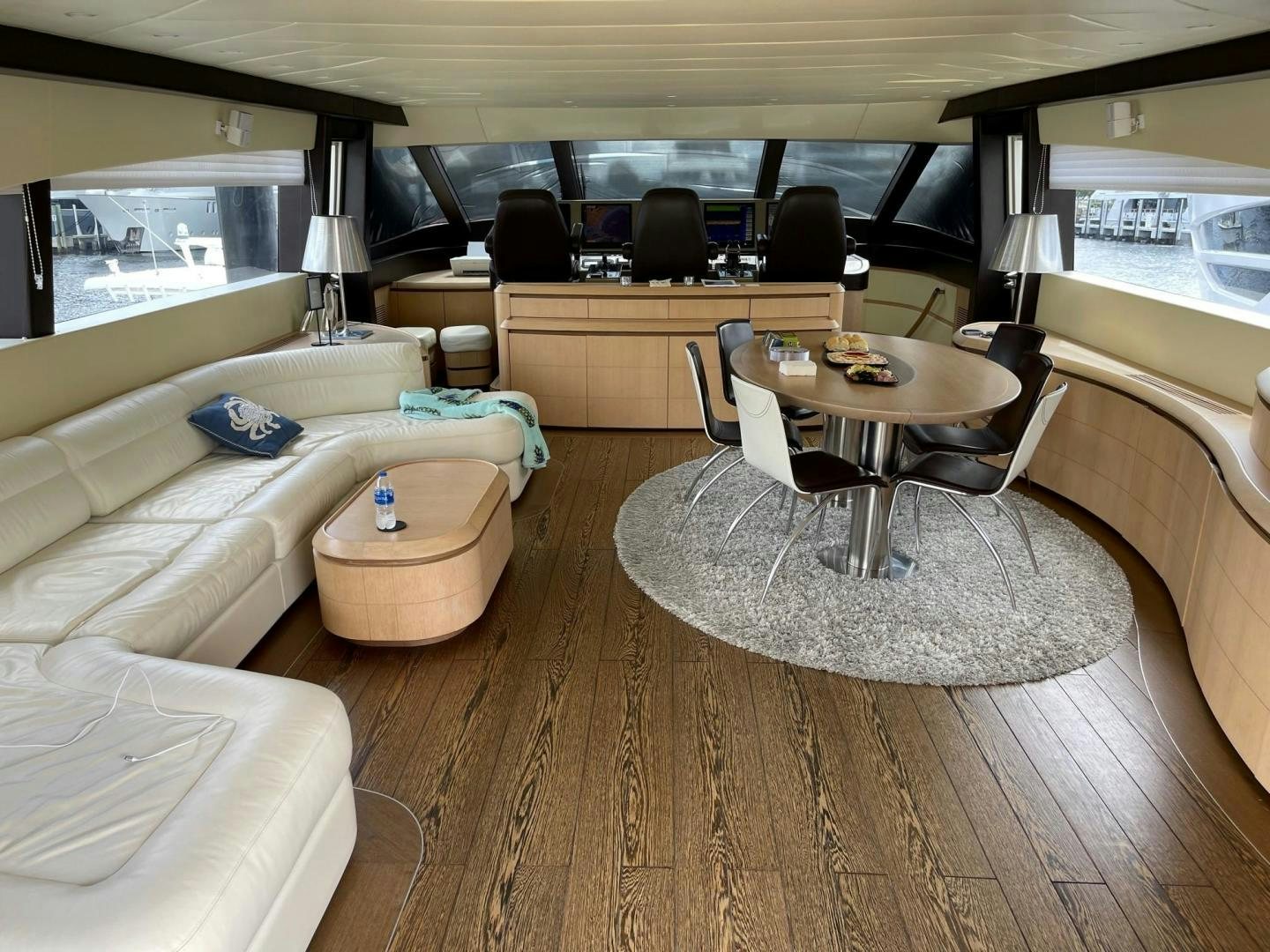 a hotel room with a table and couches aboard SILVER MAMA Yacht for Sale