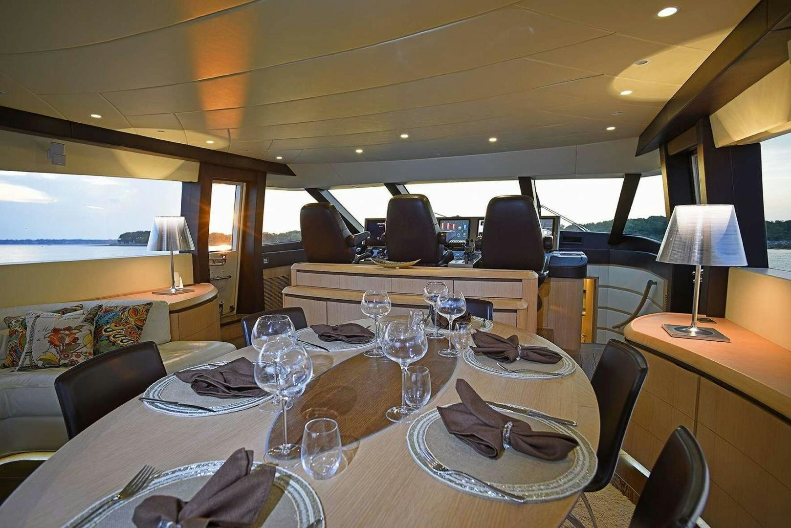 a table with plates and glasses on it aboard SILVER MAMA Yacht for Sale