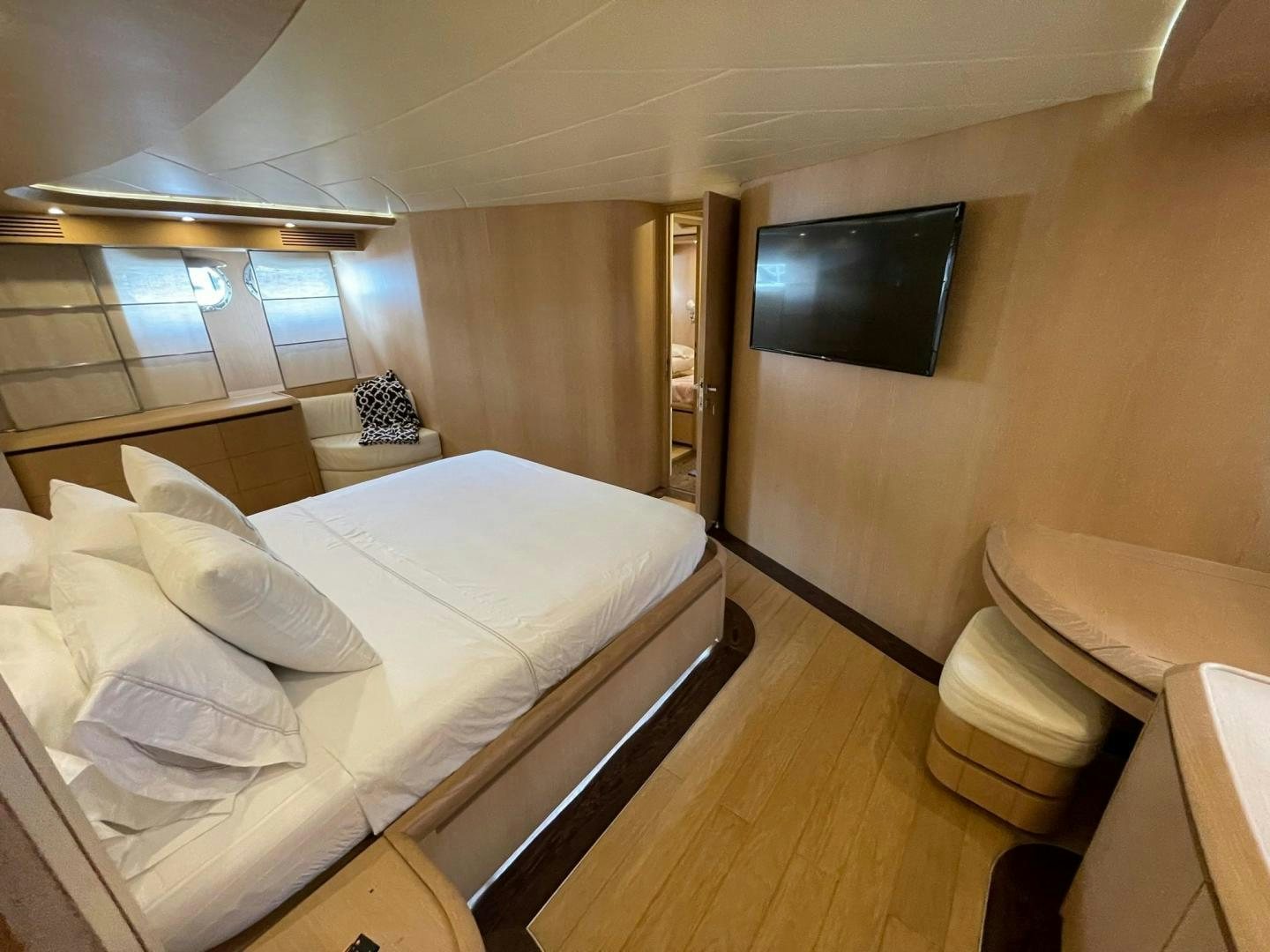 a room with a bed and a television aboard SILVER MAMA Yacht for Sale