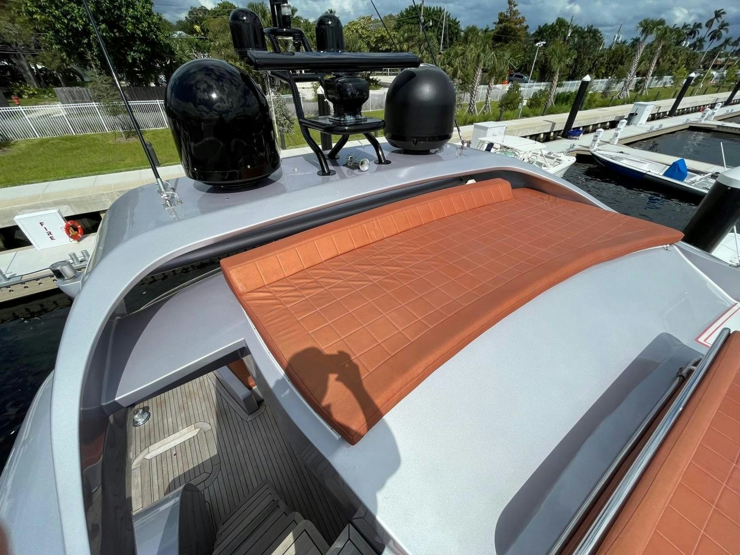 a black helmet on a white and orange surface with a black ball on it aboard SILVER MAMA Yacht for Sale