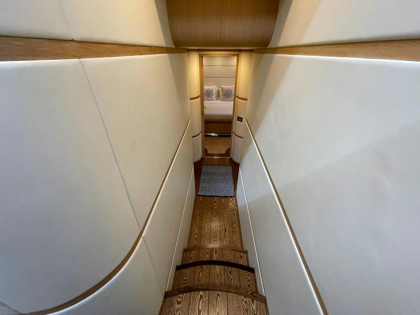 a long hallway with a wood floor aboard SILVER MAMA Yacht for Sale