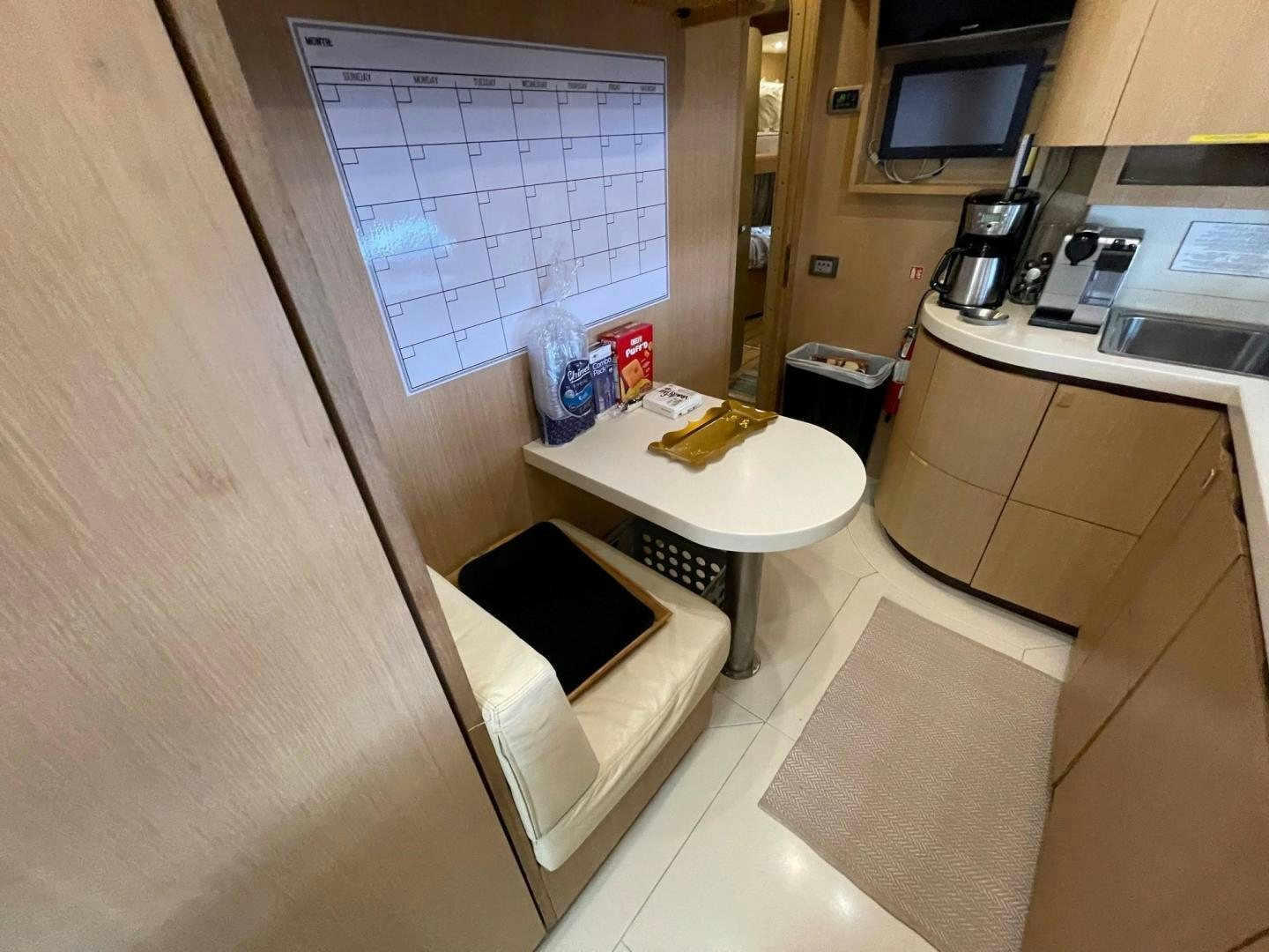a kitchen with a sink and a microwave aboard SILVER MAMA Yacht for Sale