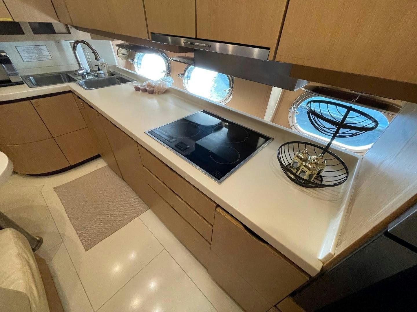 a kitchen with a sink and a stove aboard SILVER MAMA Yacht for Sale