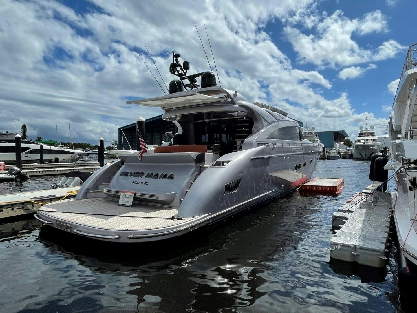 a large white boat in a harbor aboard SILVER MAMA Yacht for Sale