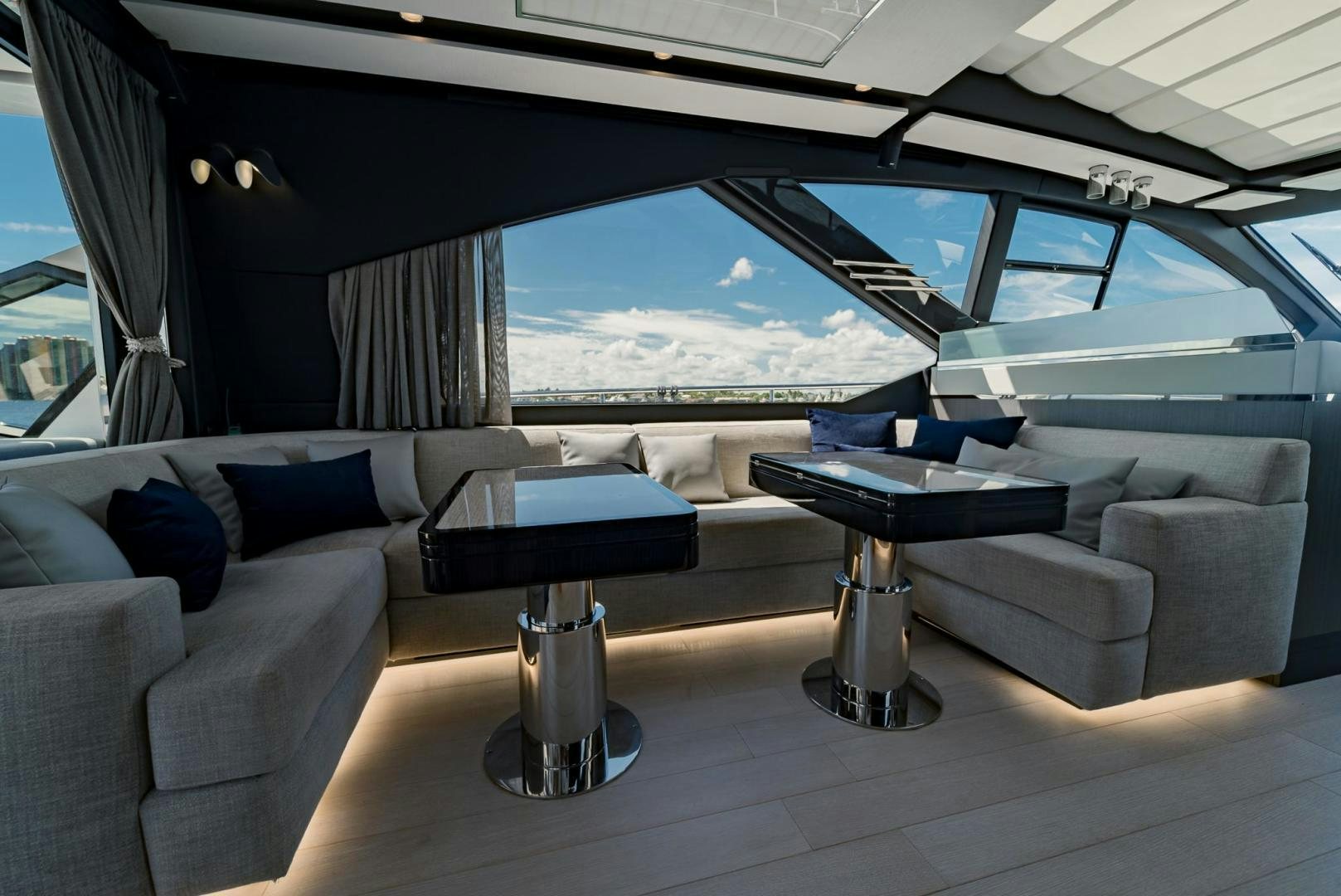 a car with a table and chairs aboard HOME SOUTH Yacht for Sale